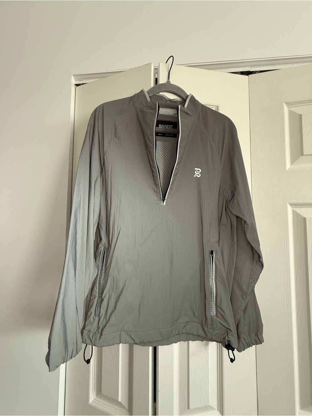 Bandit- LIGHTWEIGHT REFLECTO™ QUARTER ZIP JACKET, UNISEX - REFLECTIVE